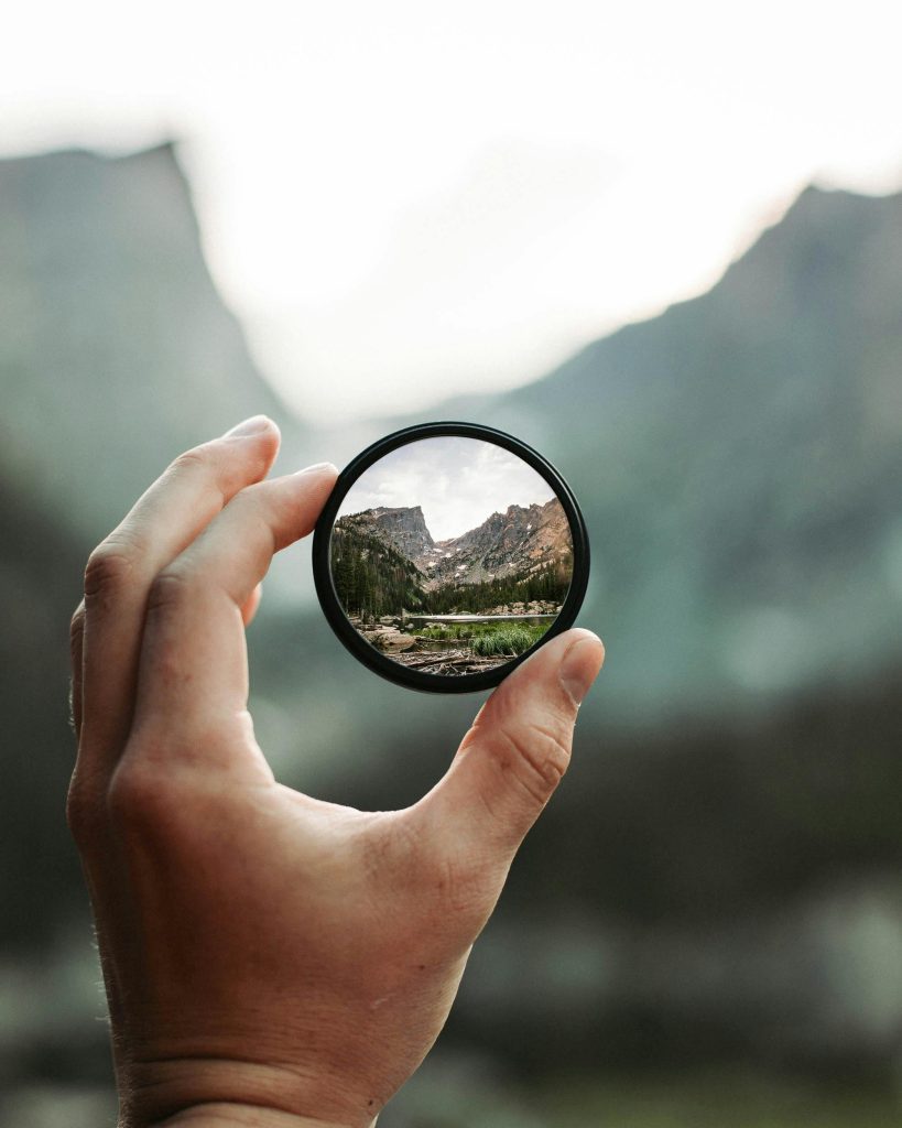 pexels photo 2853432 2853432 A stunning mountain landscape magnified through a handheld lens highlighting exploration and adventure.